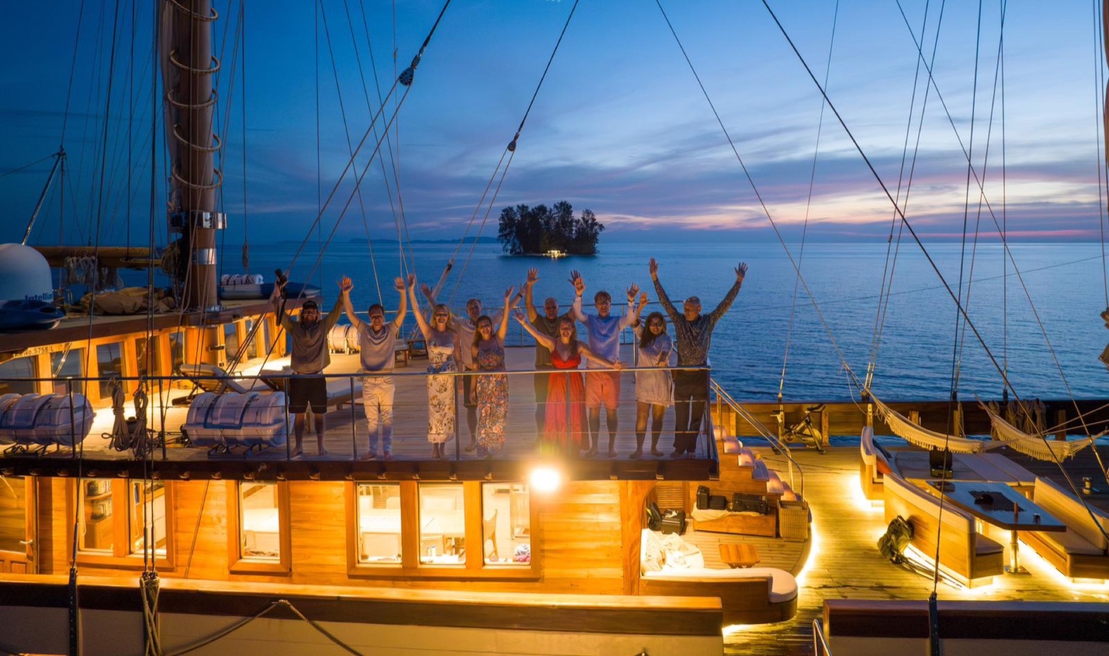 Yacht at night under crescent moon — Indian Ocean register.